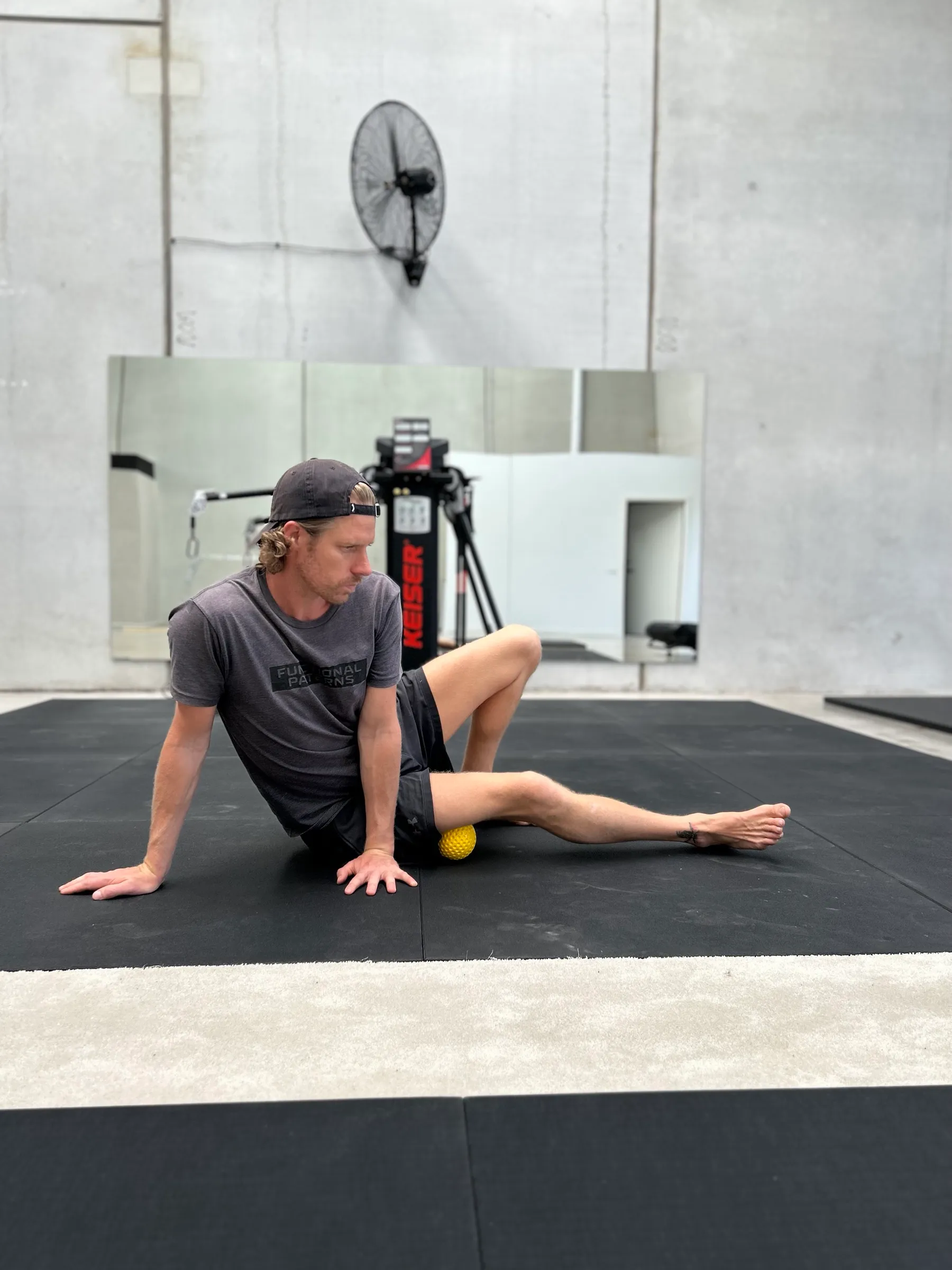Shane using a massage ball for myofascial release