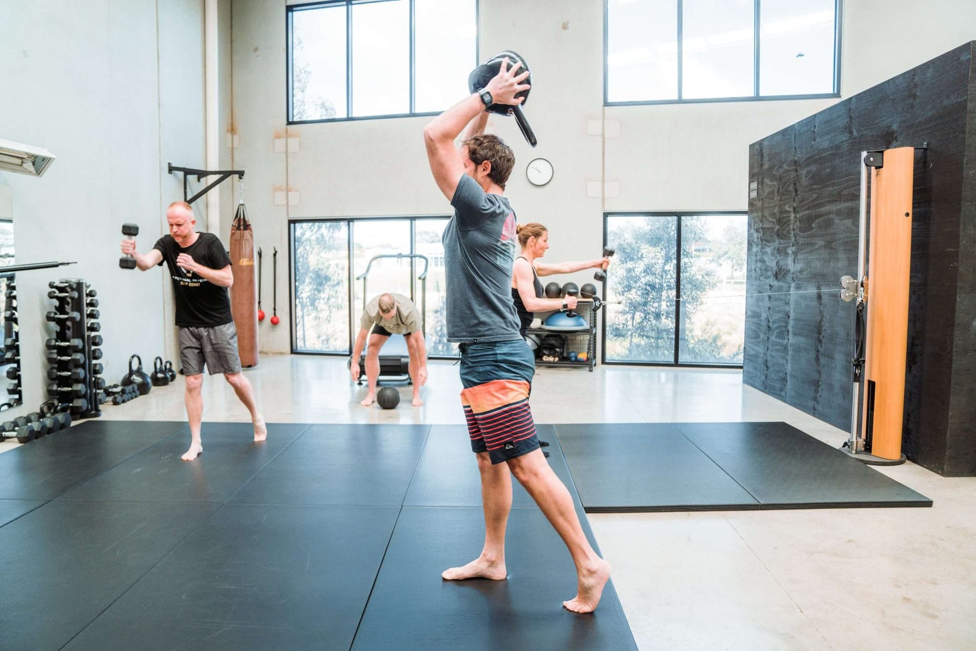 Clients training with medicine balls and dumbbells in the Torquay studio